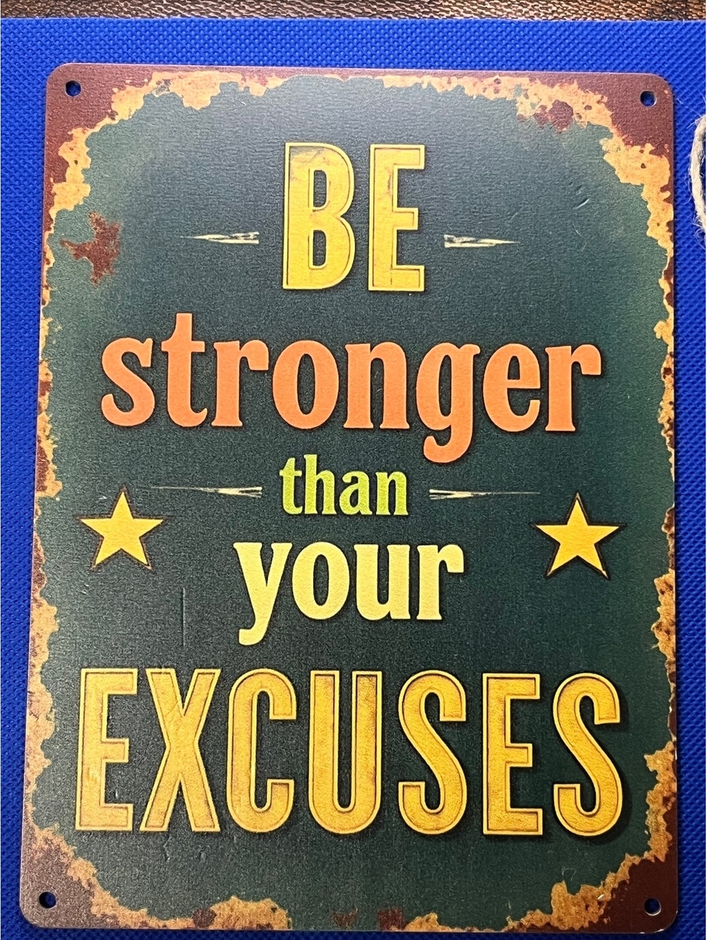 Motivational sign ‘Be Stronger Than Your Excuses’